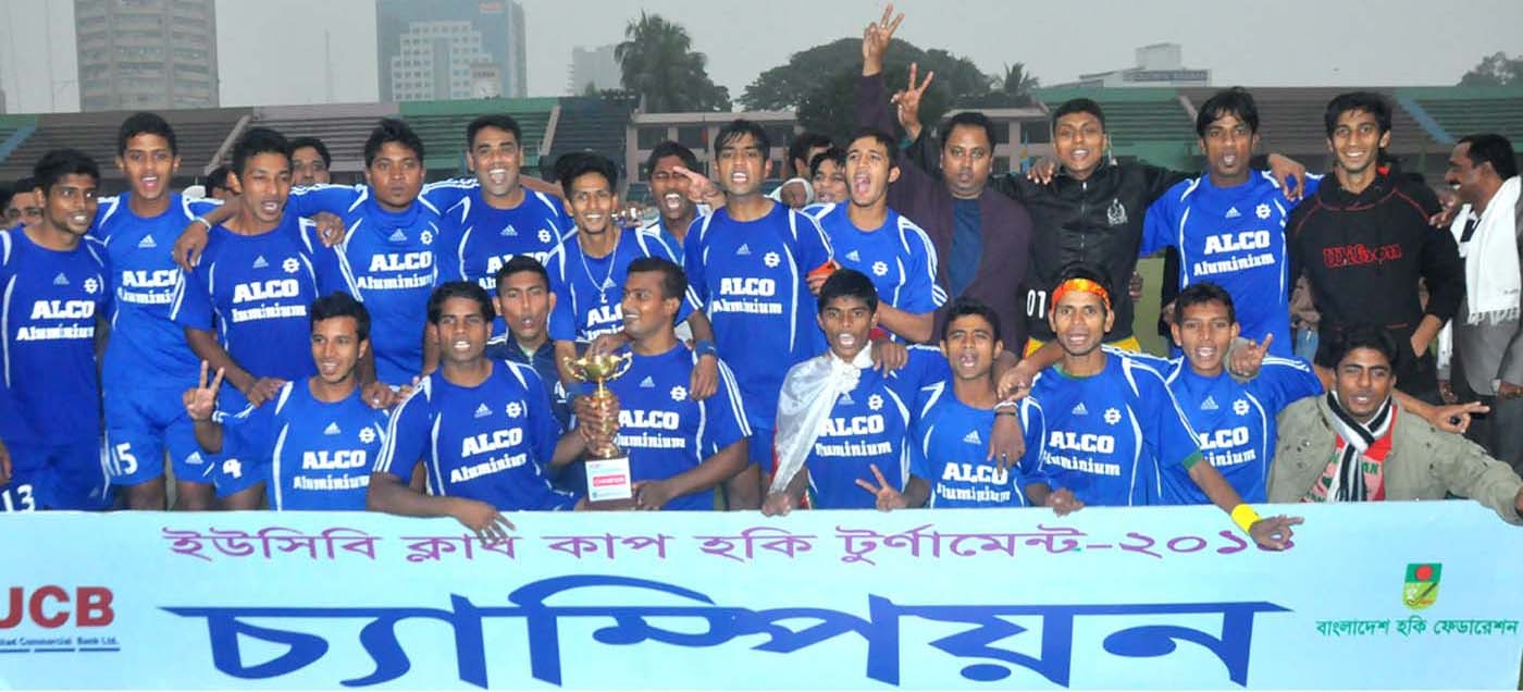 Members of Usha Krira Chakra, the champions of the UCB Club Cup Hockey pose with the championship trophy at the Moulana Bhashani National Hockey Stadium on Wednesday. Banglar Chokh
