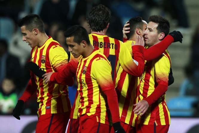 Barcelona's Lionel Messi (right) celebrates his goal with team mates during a Spanish Copa del Rey match between FC Barcelona and Getafe at the Coliseum Alfonso Perez stadium in Madrid, Spain on Thursday.