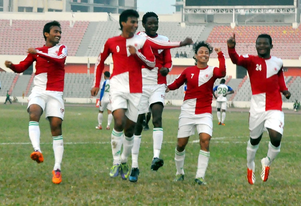 Players of Team BJMC celebrate after scoring a goal against Uttar Baridhara Club in their football match of the Bangladesh Premier League held at the Bangabandhu National Stadium on Monday. Agency photo