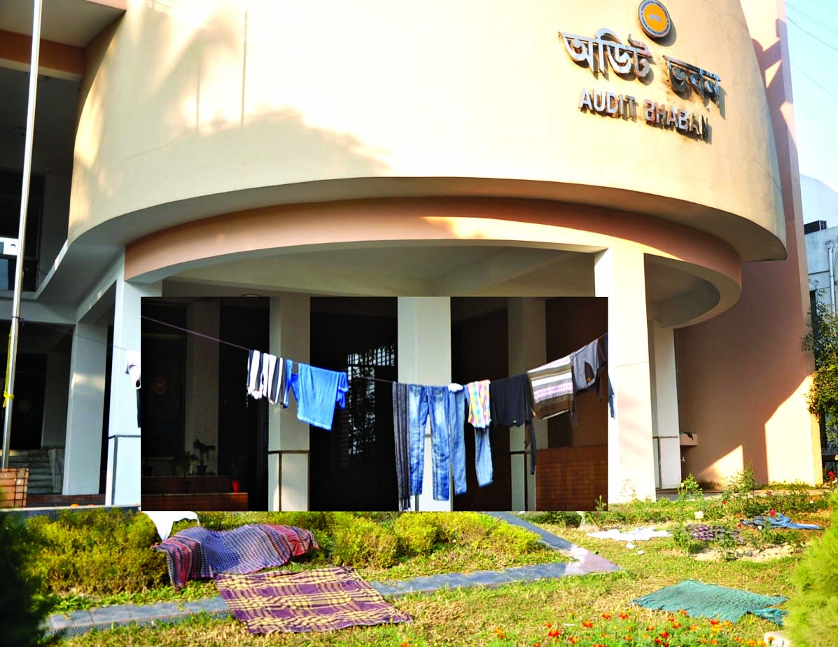 Carelessness: Clothes being hanged for drying regularly in front of the multi-storied modern building-'Audit Bhabanâ€™ on Kakrail VIP road in city. This photo was taken on Saturday.