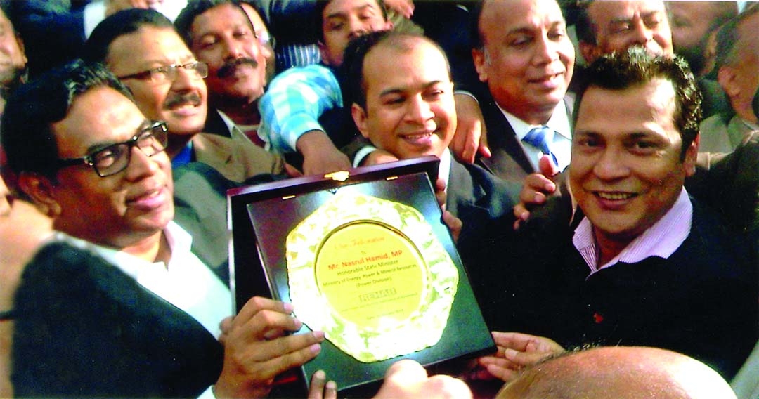 REHAB honoured State Minister for Power, Energy and Mineral Resources Nasrul Hamid with crest at Bangabandhu International Conference Centre recently. Managing Director of HL Real Estate Ragib Ahsan was also present on the occasion.
