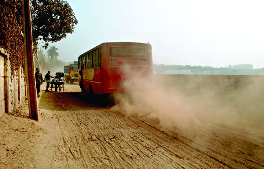 A dusty dilapidated road causing severe sufferings to commuters at Babu Bazar Beribandh in city's suberb area. This photo was taken on Monday.