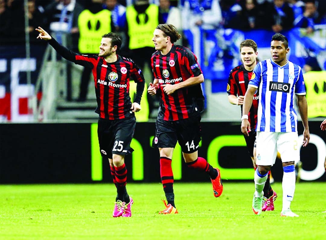 Frankfurt's Alexander Meier (center) and Frankfurt's Tranquillo Barnetta of Switzerland celebrate their side's second goal during a Europa League round of 32 second leg soccer match between Eintracht Frankfurt and FC Porto in Frankfurt, Germany on Thur