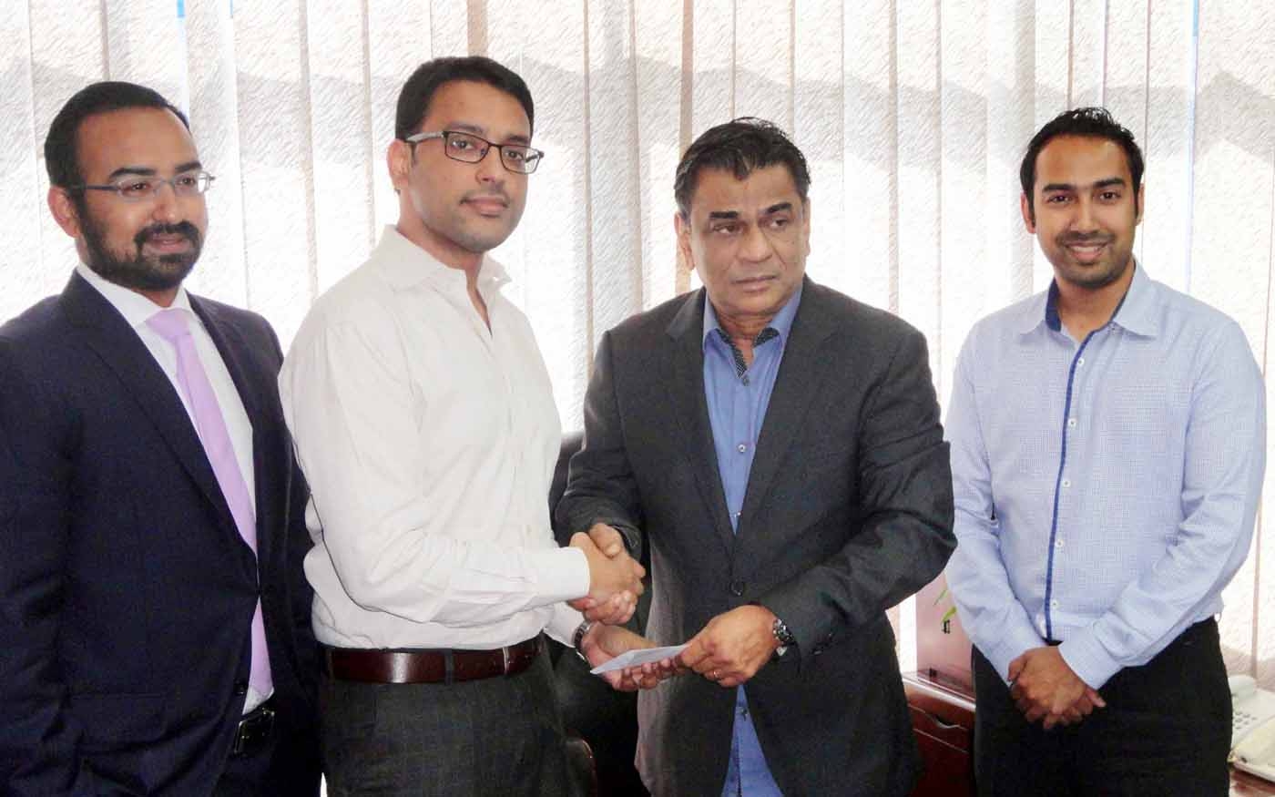 President of Bangladesh Football Federation (BFF) Kazi Salahuddin shaking hands with Director of Multisourcing Limited Md Zakir Khan after getting a cheque at the BFF House on Monday. Multisourcing Limited will act as the official mobile content provider