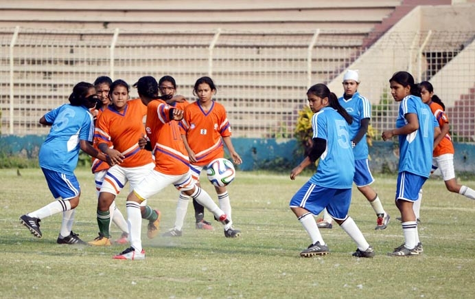 A moment of the match of KFC National Women's Football League between Joypurhat District team and Gaibandha District team held at the Rajshahi District Football Stadium on Wednesday.