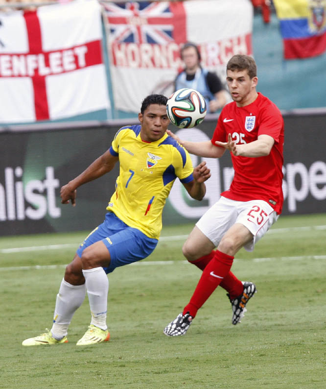 Ecuador's Jefferson Montero (left) battles for the ball with England's Jon Flanagan (25) in the second half of a friendly soccer match in Miami Gardens, Fla on Wednesday. The game ended a 2-2 tie.
