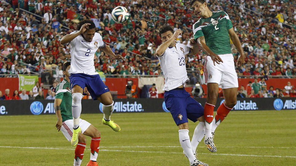 Portugal's Bruno Alves (L) defends a header from Mexico's Francisco Rodriguez (R) during an international friendly soccer match at Gillette Stadium in Foxborough, Massachusetts on Friday .
