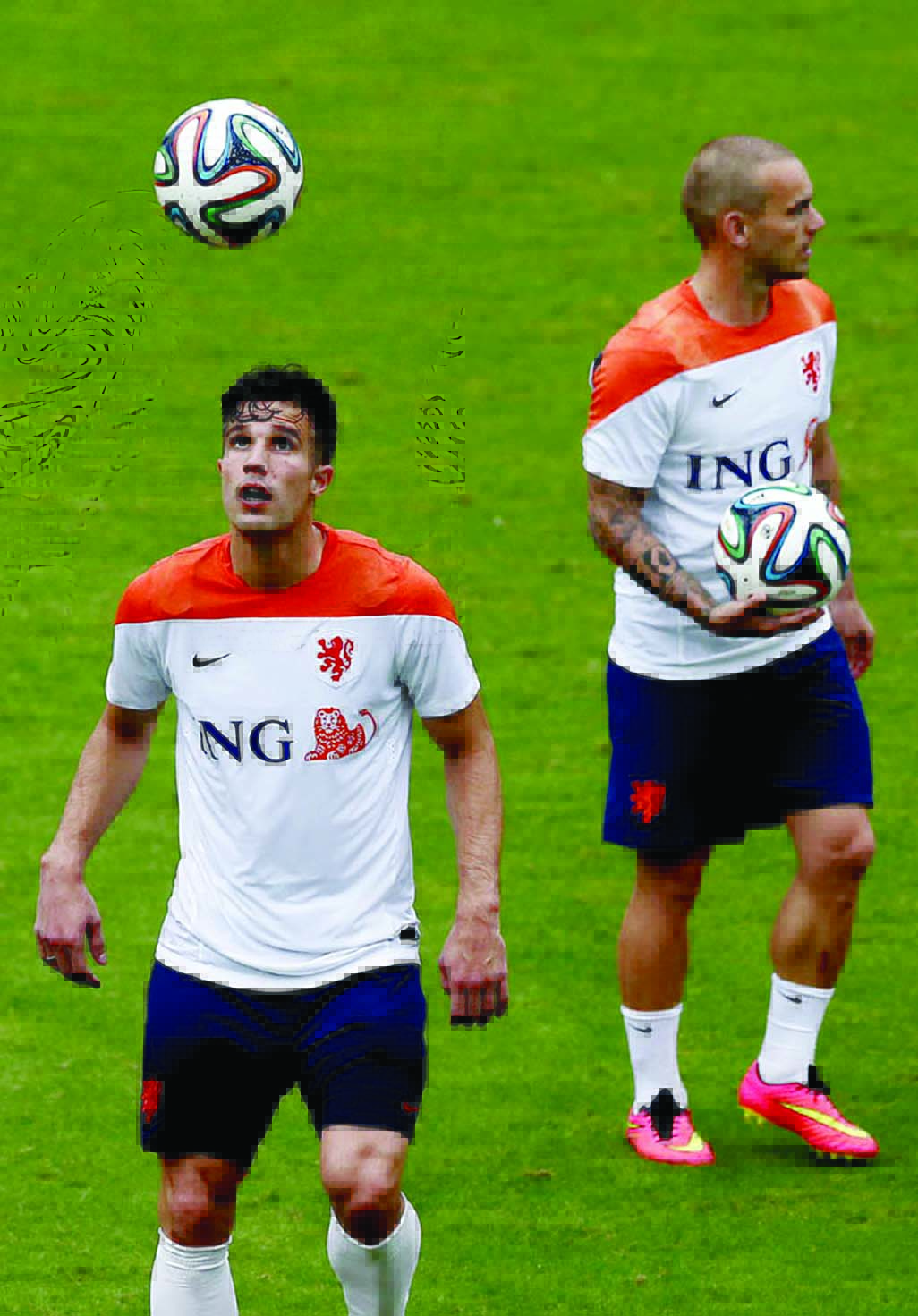 Robin van Persie (left) and Wesley Sneijder (right) of the Netherlands make their way off the field after a training session in Rio de Janeiro, Brazil on Tuesday. The Netherlands play in group B of the 2014 soccer World Cup.