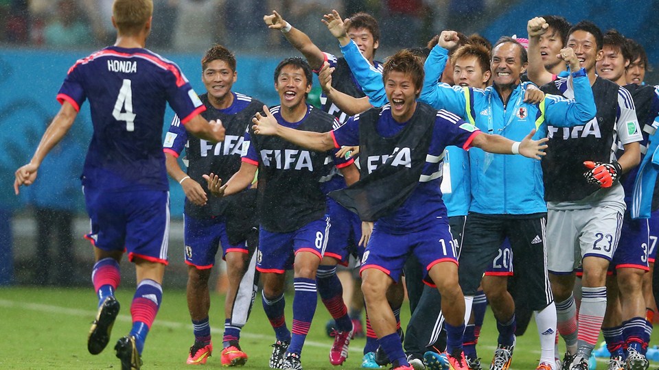 Keisuke Honda of Japan (L) celebrates after scoring the team's first goal on the sidelines during the 2014 FIFA World Cup Brazil Group C match between the Ivory Coast and Japan at Arena Pernambuco in Recife, Brazil on Saturday.