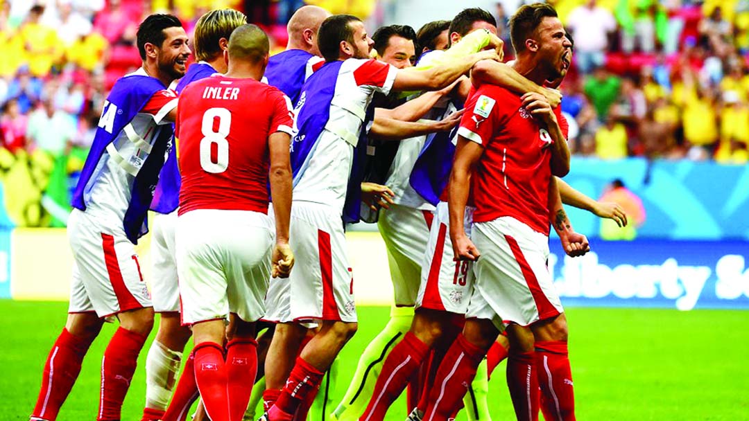 Switzerland's forward Haris Seferovic (R) celebrates with teammates after scoring during a Group E football match between Switzerland and Ecuador at the Mane Garrincha National Stadium in Brasilia during the 2014 FIFA World Cup on Sunday. Switzerland won