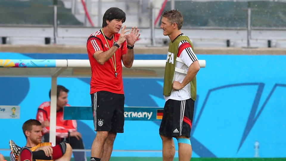 Joachim Loew, head coach of Germany talks to Bastian Schweinsteiger during the German national team training at Estadio Mineirao in Belo Horizonte, Brazil on Monday.