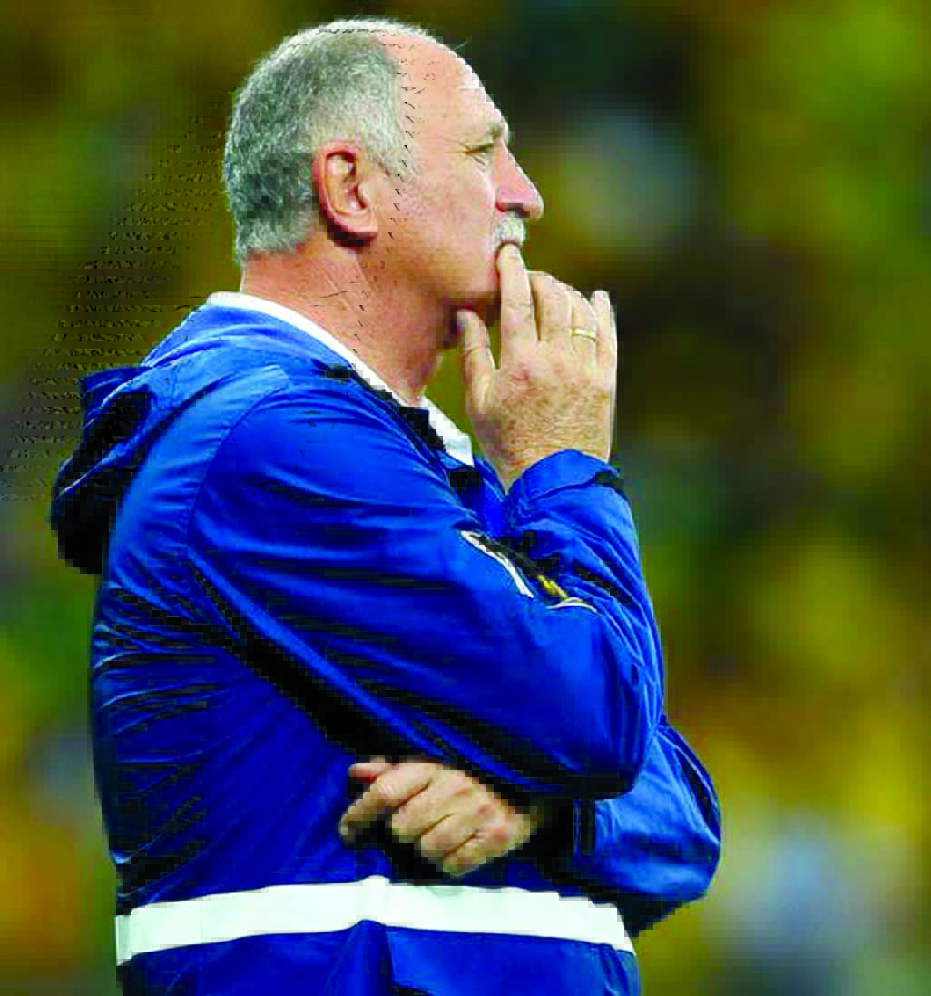 Head coach Luiz Felipe Scolari of Brazil looks on after conceding five goals in the first half during the 2014 FIFA World Cup Brazil semi final match between Brazil and Germany at Estadio Mineirao in Belo Horizonte, Brazil on Tuesday.