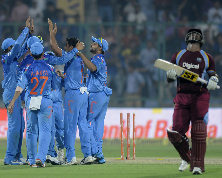 A despondent Dwayne Smith walks back after falling for 97 during the 2nd ODI between India and West Indies in Delhi on Saturday.