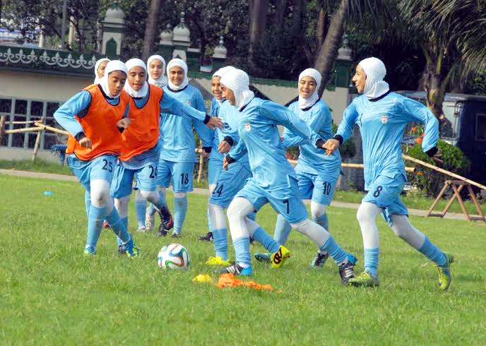 Players of Iran Under-16 National Women's Football team take part in their practice session at the Rajarbagh Police Line Ground on Thursday.