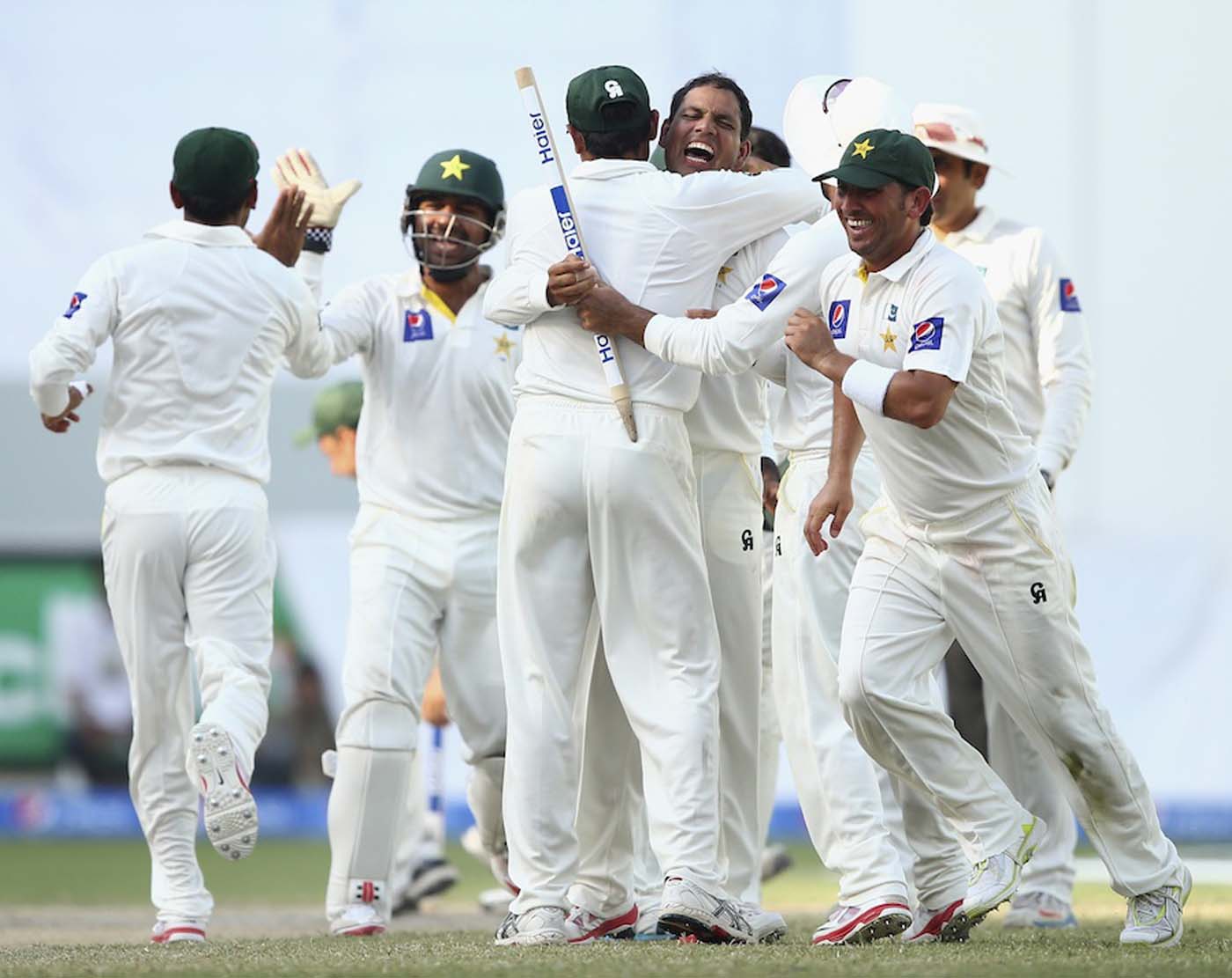 Pakistan celebrate a 221-run victory Australia on the day five of the first Test at Dubai International Stadium in Dubai, United Arab Emirates on Sunday.