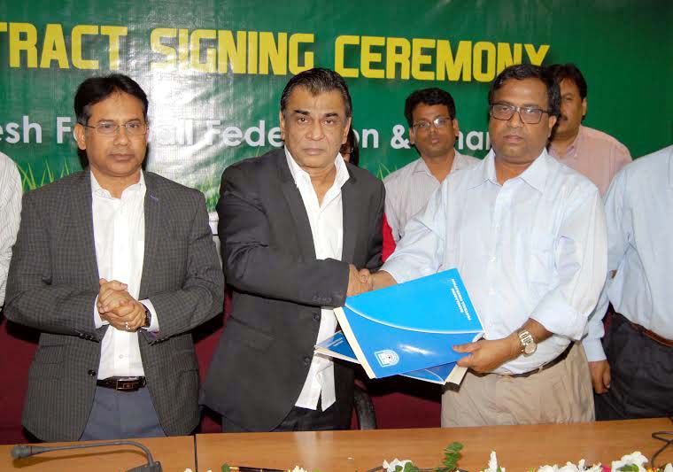 BFF president Kazi M Salahuddin (2nd from left) and Channel 9 Managing Director Enayatur Rahman shaking hands after signing an agreement for their respective organization at the BFF conference room on Thursday.