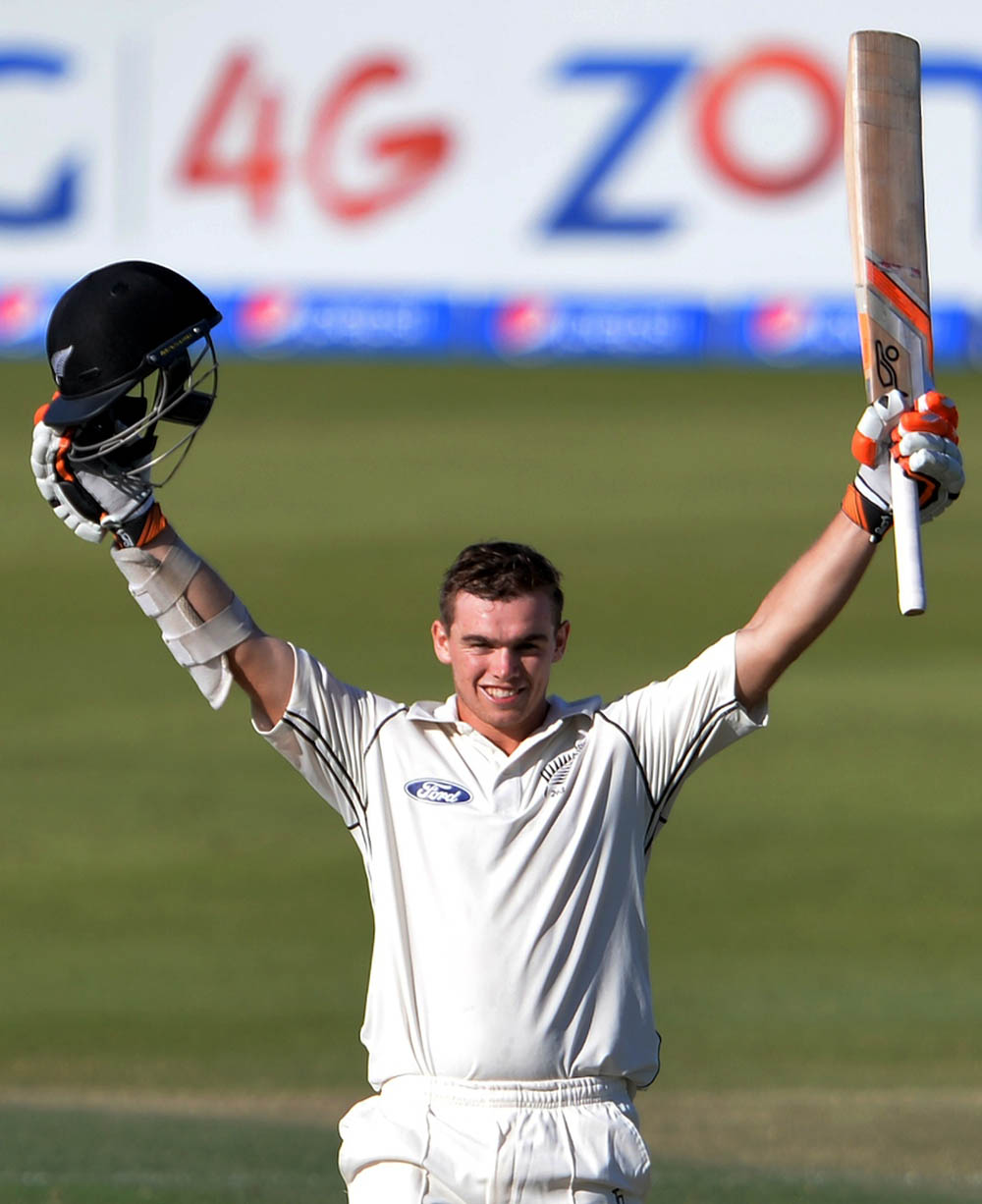 New Zealand batsman Tom Latham celebrates after scoring a century during the third day of the first Test match between Pakistan and New Zealand at the Zayed International Cricket Stadium in Abu Dhabi on Tuesday. Pakistan lead by 319 runs with 10 wickets r