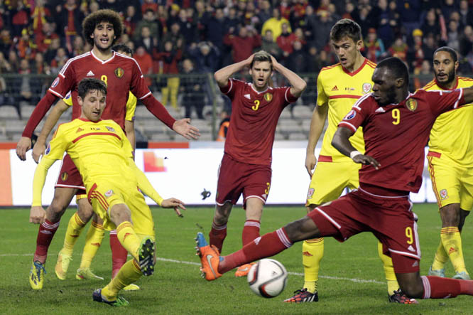 Belgium's Christian Benteke (right) shoots the ball during the Euro 2016 qualifying match in Group B between Belgium and Wales at the King Baudouin Stadium in Brussels on Sunday.