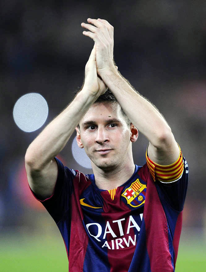 FC Barcelona's Lionel Messi, from Argentina, applauds at the end of the Spanish La Liga soccer match against Sevilla, at the Camp Nou stadium in Barcelona, Spain, Saturday.
