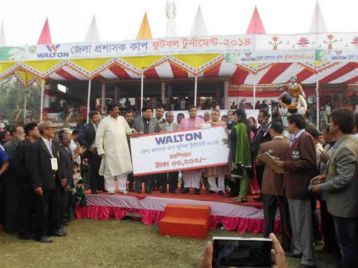 Chairman of the Parliamentary Standing Committee on the Ministry of Youth and Sports Zahid Ahsan Russel, MP handing over the cheque of Tk twenty thousand to Ashashuni Upazila team, the champions of the Walton DC Cup Football Tournament Satkhira at the Sat