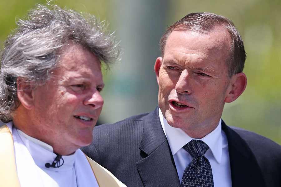 Australian Prime Minister Tony Abbott also arrives for Phillip Hughes' funeral service.