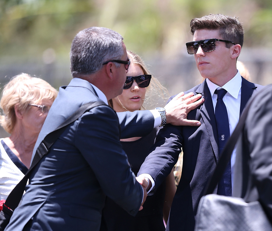 Sean Abbott (R) arrives for Phillip Hughes' funeral service in Macksville on Wednesday.
