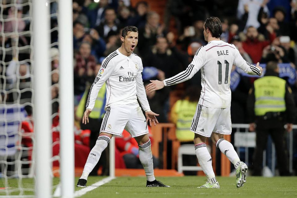 Real Madrid's Cristiano Ronaldo (left) celebrates towards his team mate Gareth Bale after scoring a goal during a Spanish La Liga soccer match between Real Madrid and Celta de Vigo at the Bernabeu stadium in Madrid, Spain on Saturday.
