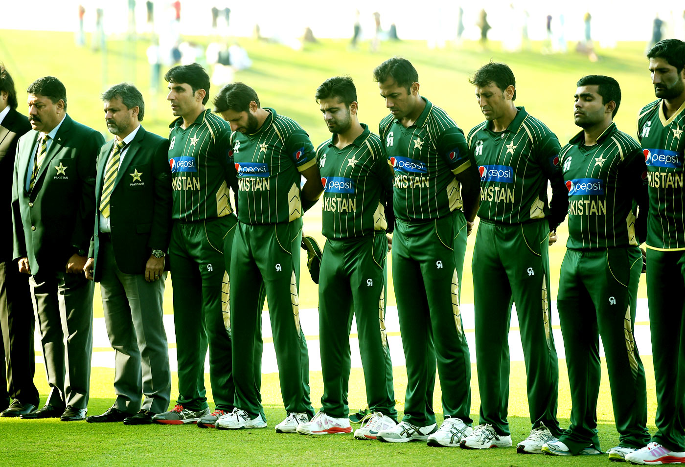 The Pakistan team observes two minutes of silence in memory of the victims of the Peshawar terror attack, during the 4th ODI between Pakistan and New Zealand in Abu Dhahi on Wednesday.