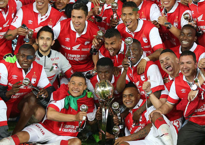 Santa Fe's players celebrate at the end of the Colombian league soccer final game against Deportivo Independiente Medellin in Bogota, Colombia on Sunday. Santa Fe won the championship with a 3-2 aggregate score.