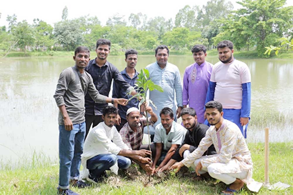 Photo session at the tree plantation programme of the RKS Foundation at West Banskhali in Chattogram.