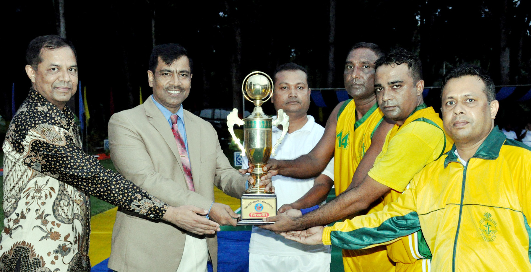 Air Officer Commanding of BAF Base Bir Shreshtha Matiur Rahman Air Vice Marshal Sheikh Abdul Hannan giving away trophy to BAF Base Bir Shreshtha Matiur Rahman team who won the BAF Basketball title at the play ground of Bangladesh Air Force (BAF) Base Bir