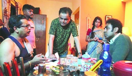 Mosharraf Karim (left), director Bratya Basu (centre standing) among others at the shooting spot of movie 'Hubba' in Kolkata