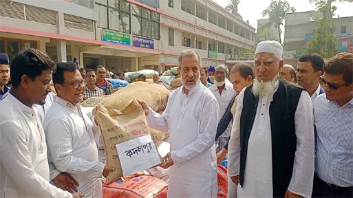 Chairman of the Parliamentary Standing Committee on Ministry of Railways, A B M Fazle Karim Chowdhury MP distributing agri-materials (seeds of paddy, fertilizers) to the farmers of Raozan on the premises of upazila office as the chief guest yesterday.