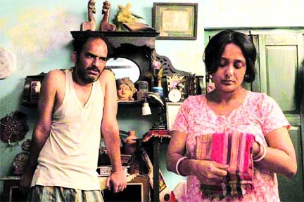 Ritwick Chakraborty and Aupee Karim in a scene from movie 'Mayar Jonjal'