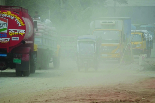Vehicles ply through a dusty and heavily polluted road at Shyampur in the capital on Friday. Dust pollution has reached an alarming level in Dhaka due to road digging, construction work and rundown roads.