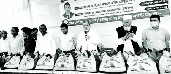 ABM Fazle Karim Chowdhury MP, President of the Parliamentary Standing Committee on Railway Ministry, addressing the Iftar distribution cemeremony in Raozan yesterday as the chief guest. NN photo