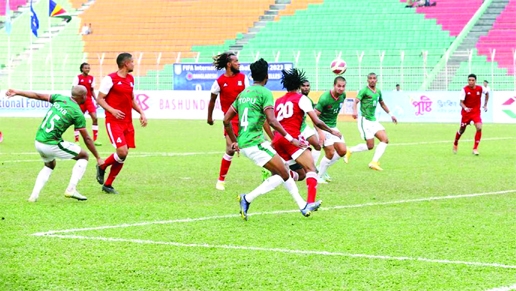 Bangladesh's Tariq Kazi (2nd right) attempts to head the ball during a FIFA friendly match against Seychelles at the Sylhet District Stadium on Saturday.